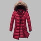 Mid-length women's winter coat with fleece lining, detachable hood with fur trim, quilted design.