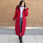 Woman wearing red full-length puffer coat, stylish winter maxi design.