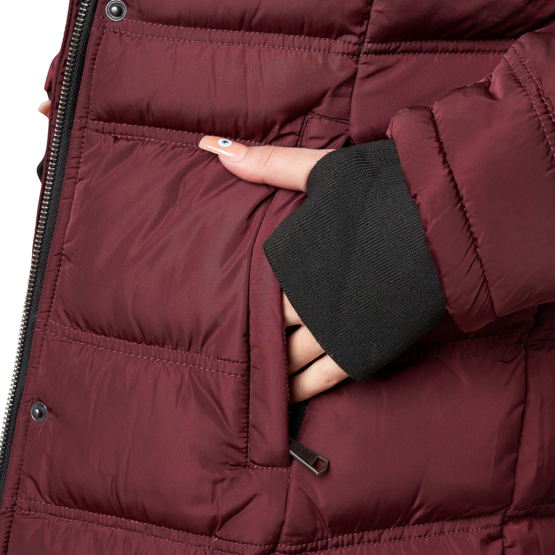 Close-up of Elora Maxi Puffer coat in burgundy, featuring metal zipper and knit rib cuff.