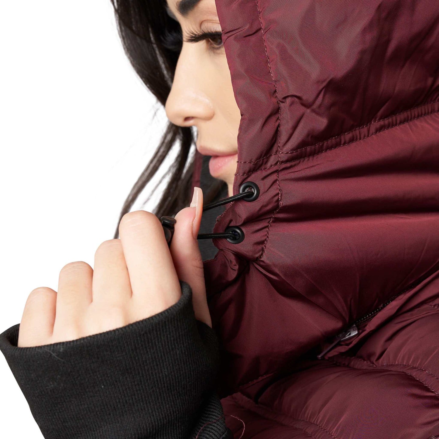 Woman wearing Elora Maxi Puffer vegan winter coat with detachable hood.