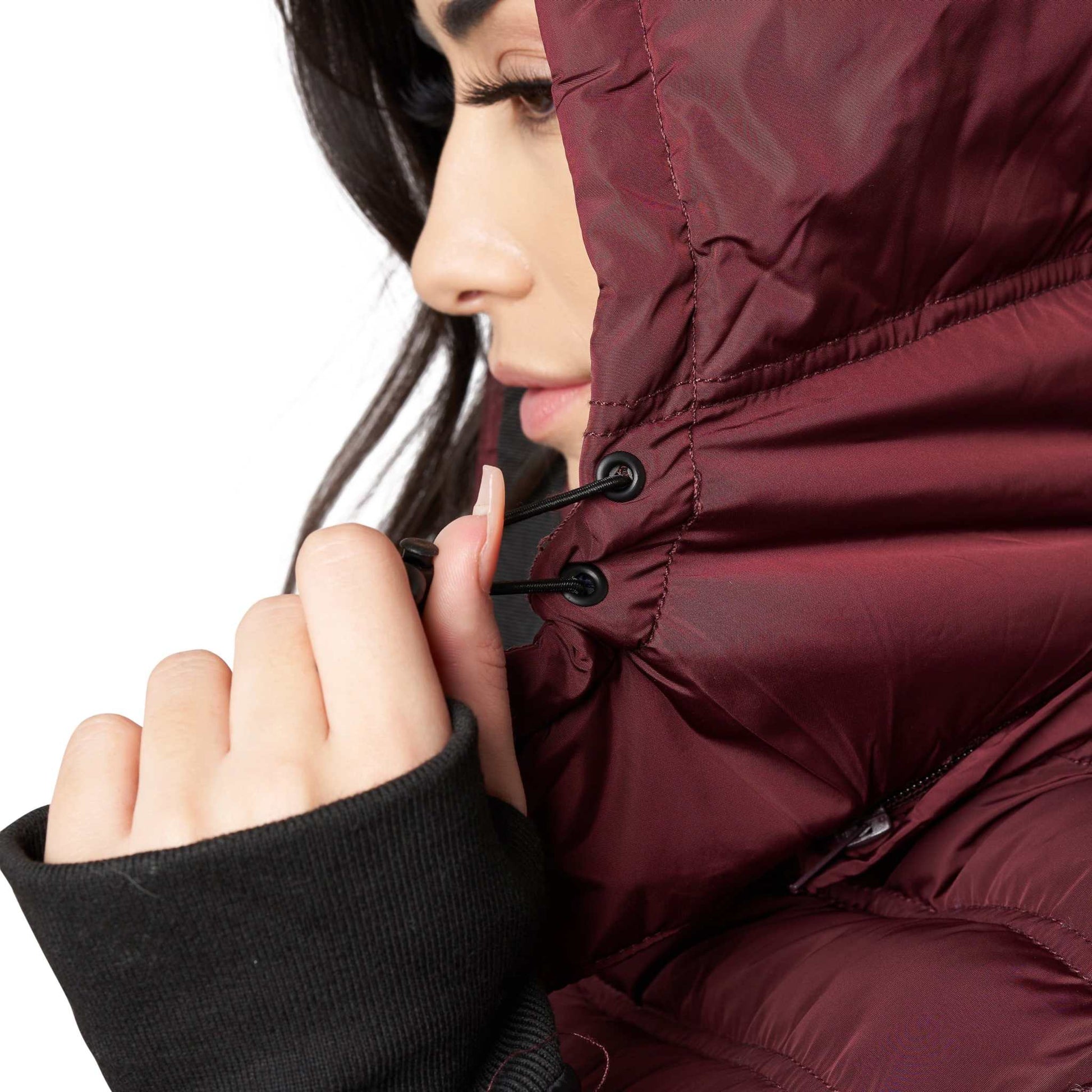 Woman wearing Elora Maxi Puffer vegan winter coat with detachable hood.