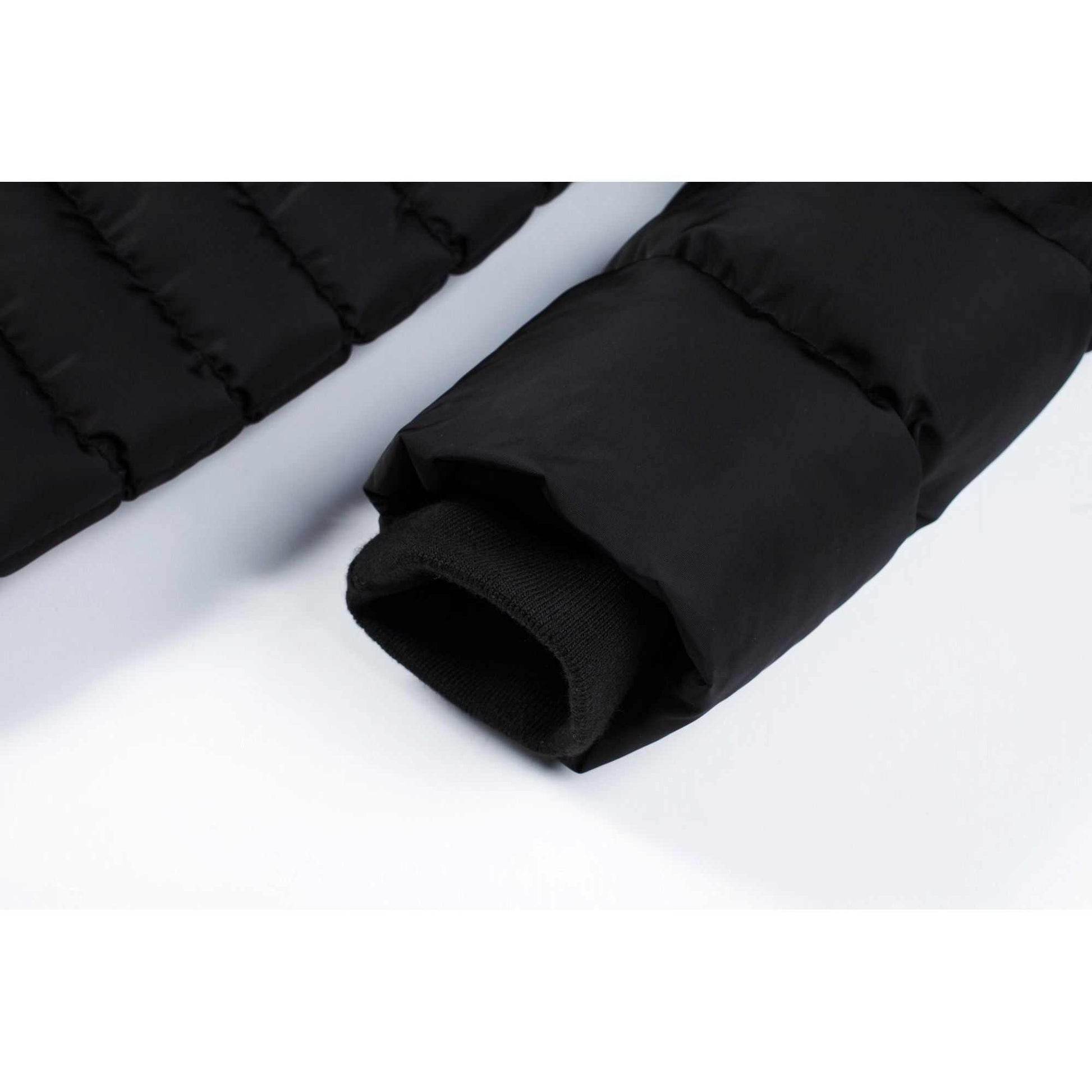 Mid-length women's winter puffer coat with fleece lining and ribbed cuffs.