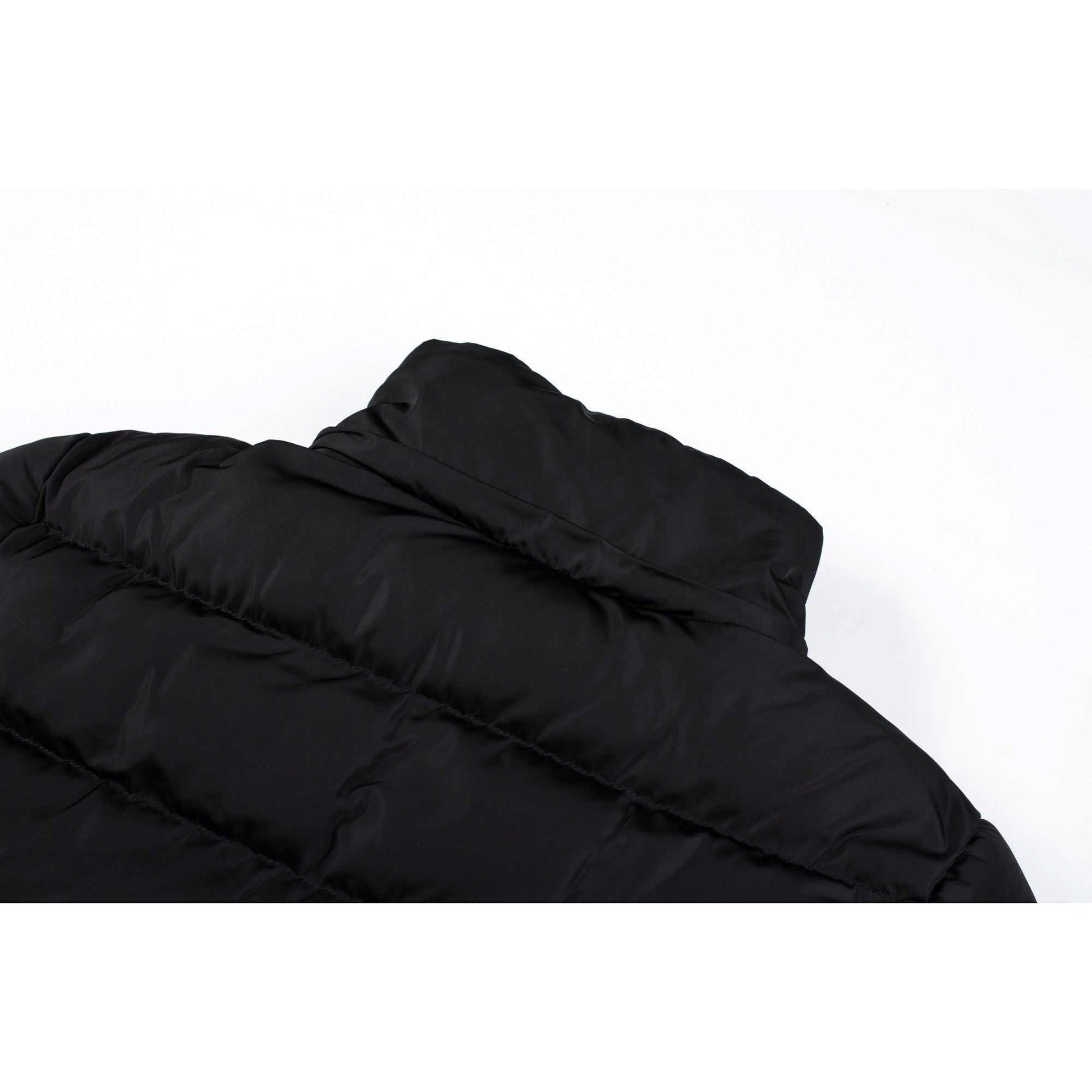 Mid length women's winter coat with fleece lining and detachable hood.